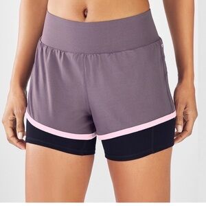 Fabletics Olesia 2 in 1 biker and running shorts in purple and black